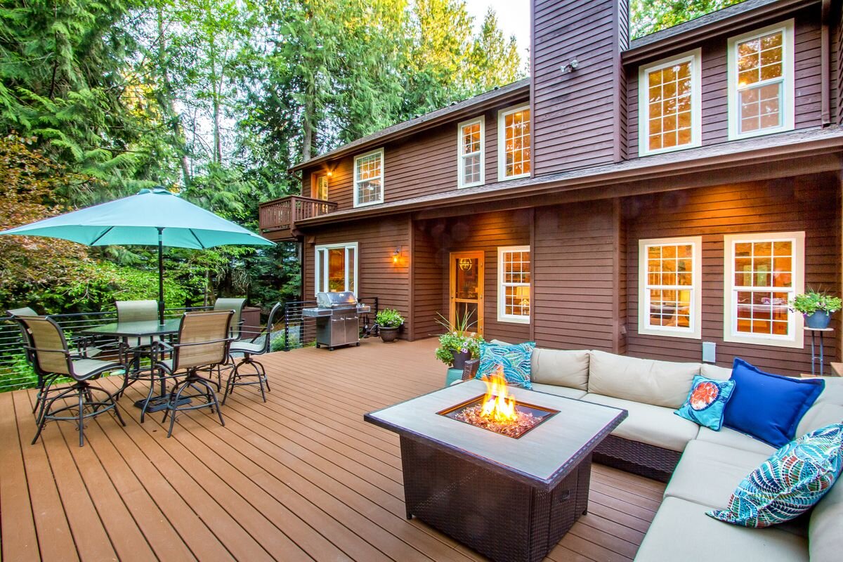  The backyard landscaping was completely redone in 2017, with an expanded outdoor living area that features multiple seating and dining spaces that invite family and guests to enjoy the clean air, peace, and quiet atmosphere of Bainbridge Island. Not