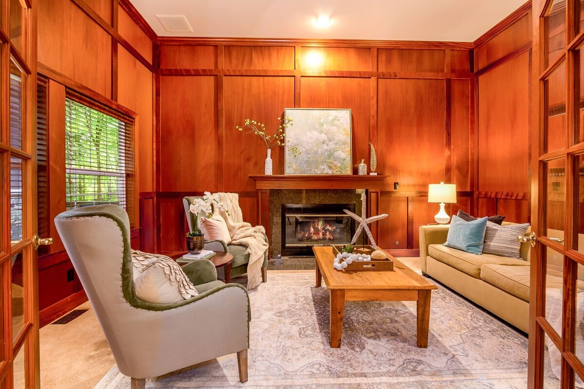  Multi-light French doors lead to the floor-to-ceiling mahogany panelling in the office/den, which features a traditional propane fireplace. This is a wonderful TV room or could be a 'certifiable man cave,' as it has a built-in humidor exhaust fan de