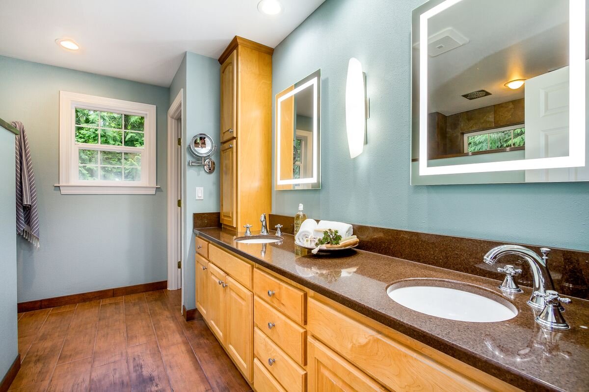  Enjoy the heated floors, quartz countertops, undermount sinks, new bath fixtures, lighting and lighted mirrors in this spacious master bath. 