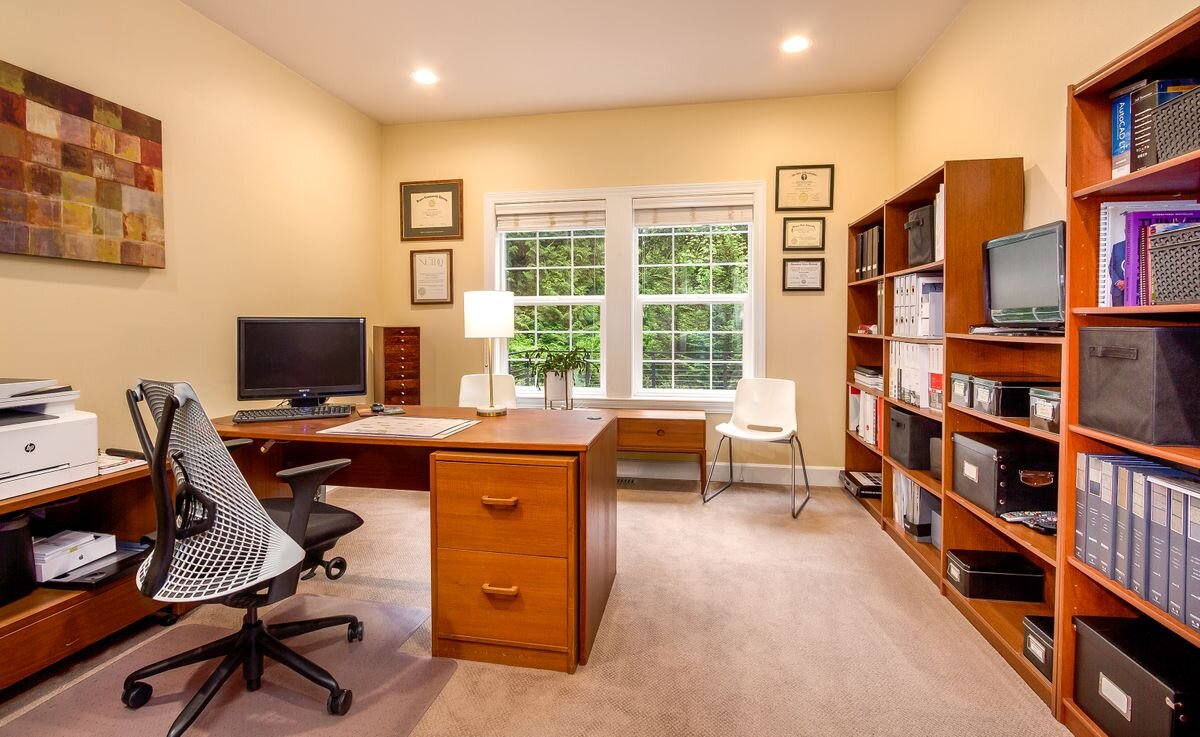  The second office is located on a 'mezzanine level' next to the great room. It also offers an inspiring view into the verdant backyard landscape. 