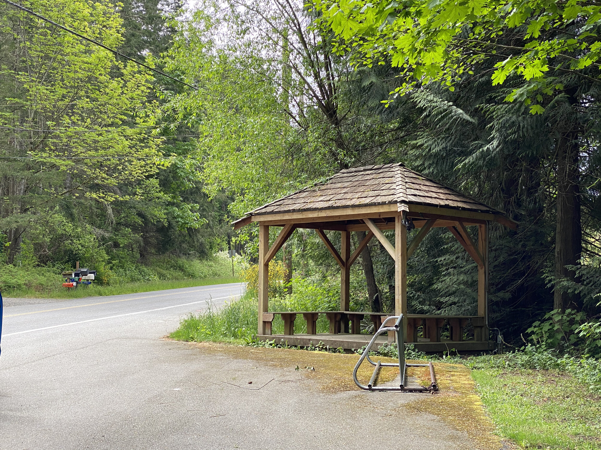  This covered bus stop with well-placed bike rack near the entrance to Hidden Cove Estates makes a natural community gathering spot during the school year. Kitsap Transit is timed to the ferry schedule during commuter hours, making it an easy trip in