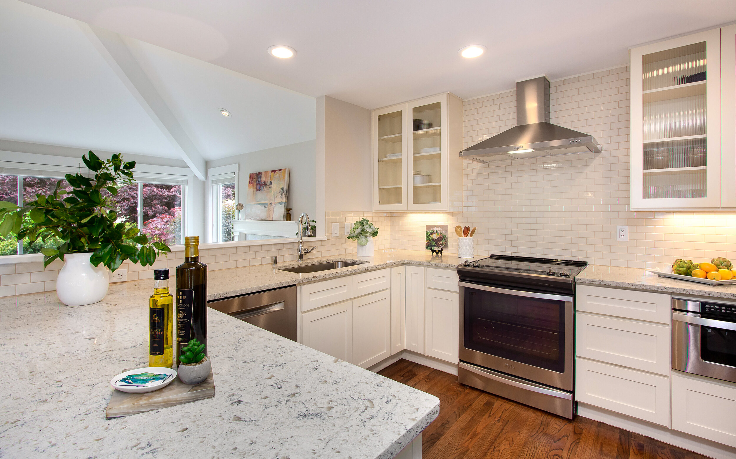  Enjoy this stunning kitchen, complete with beautiful white stone counters and updated stainless steel appliances, as you whip up a meal.&nbsp; 