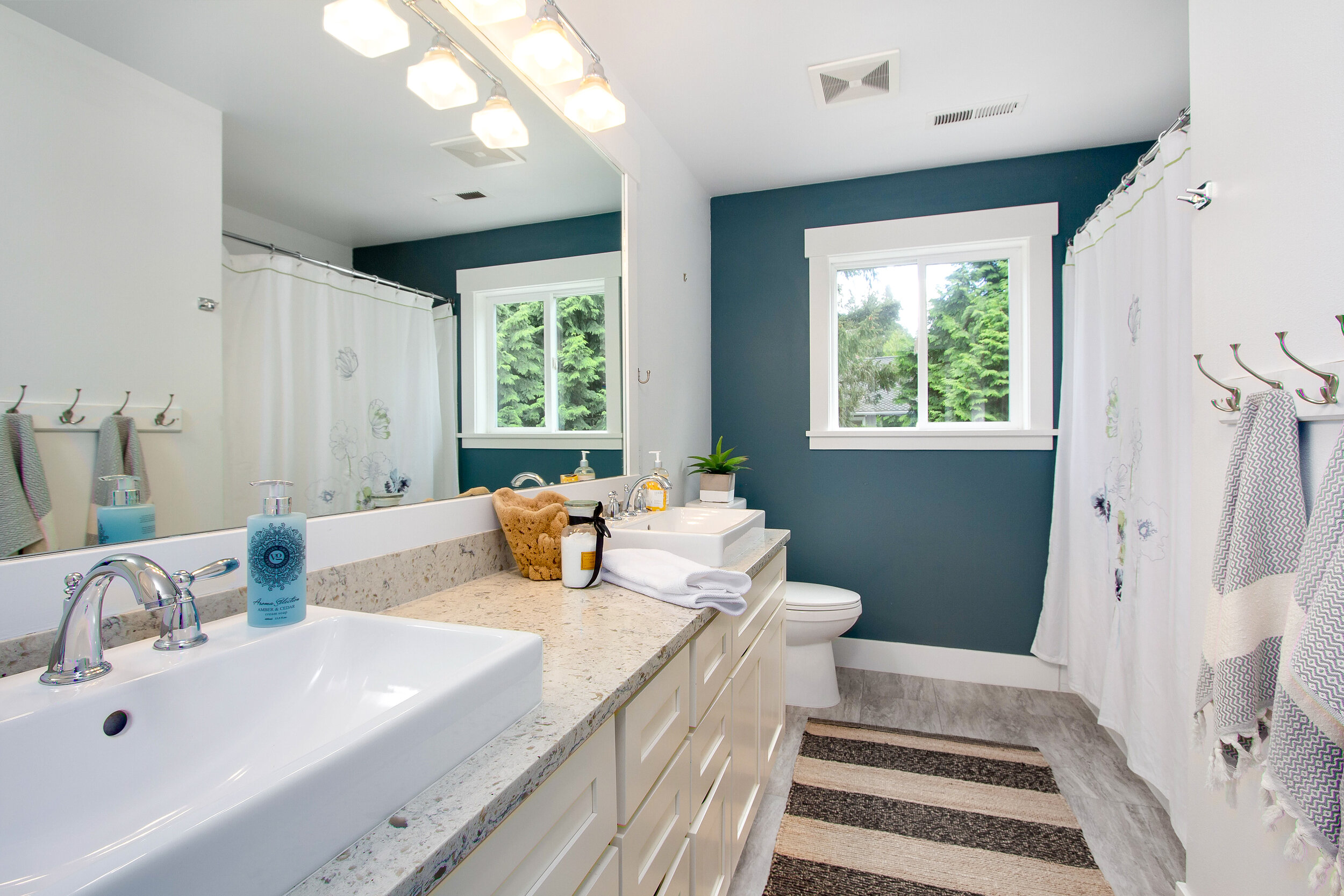  A second bath is equipped with dual sinks for the spare bedrooms to share.&nbsp; 