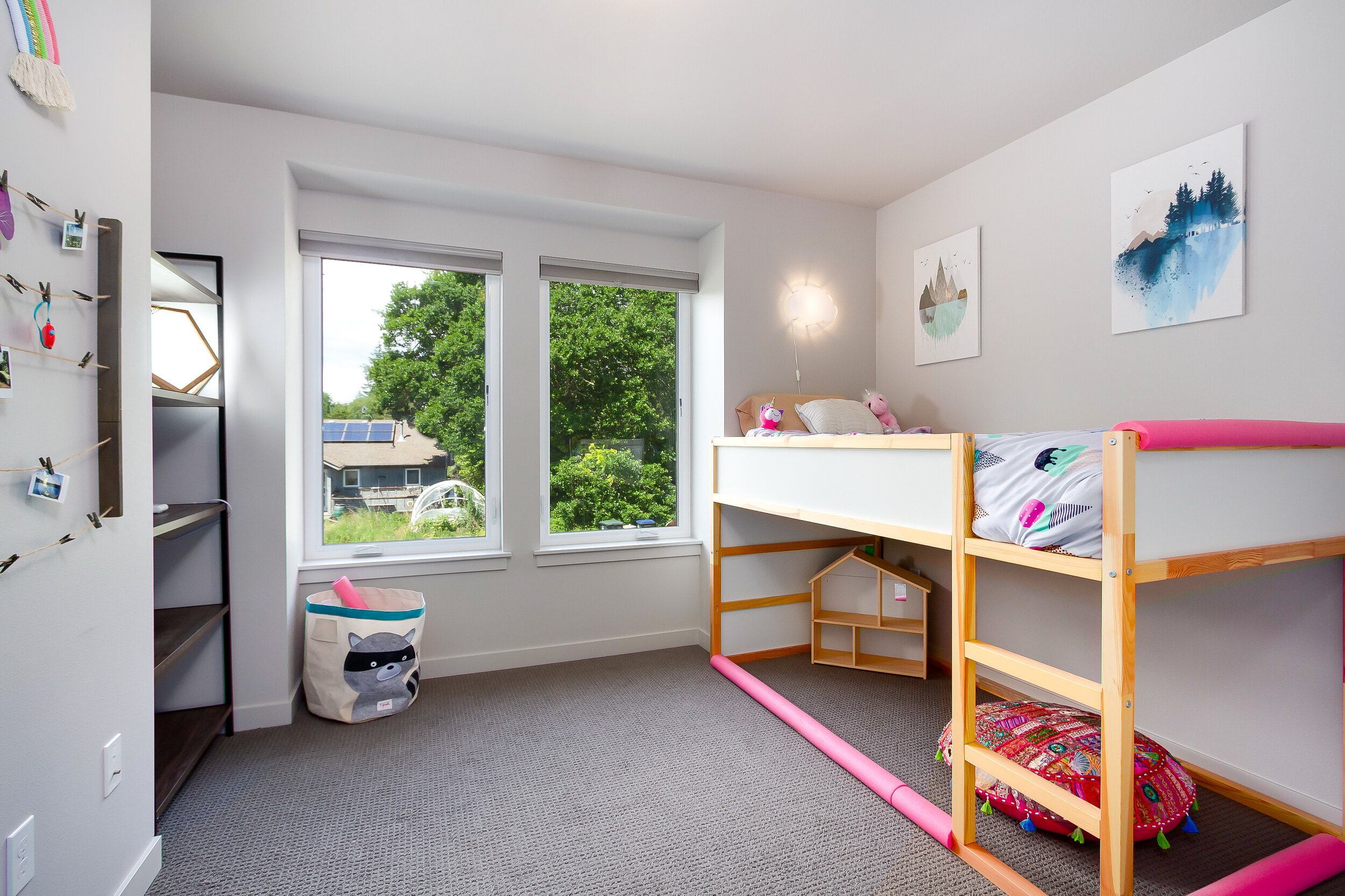 The second and third bedrooms on the main floor offer plenty of space and natural light. 
