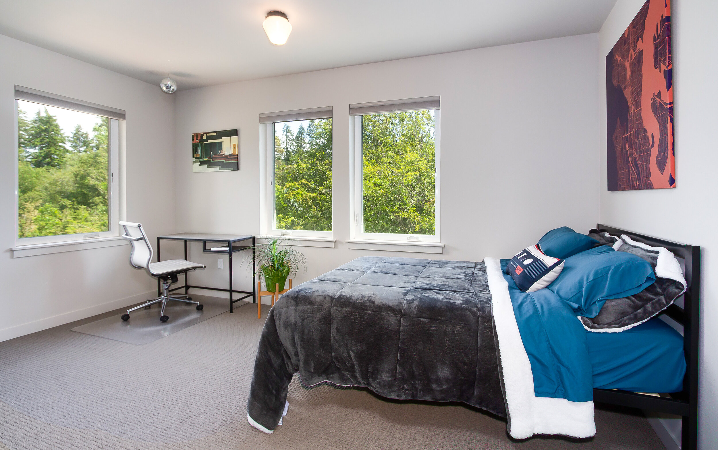 The second and third bedrooms on the main floor offer plenty of space and natural light. 