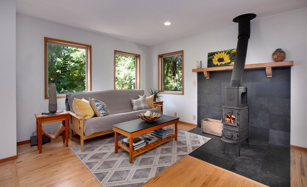 Cozy up in the corner around this classic wood-burning fireplace. 