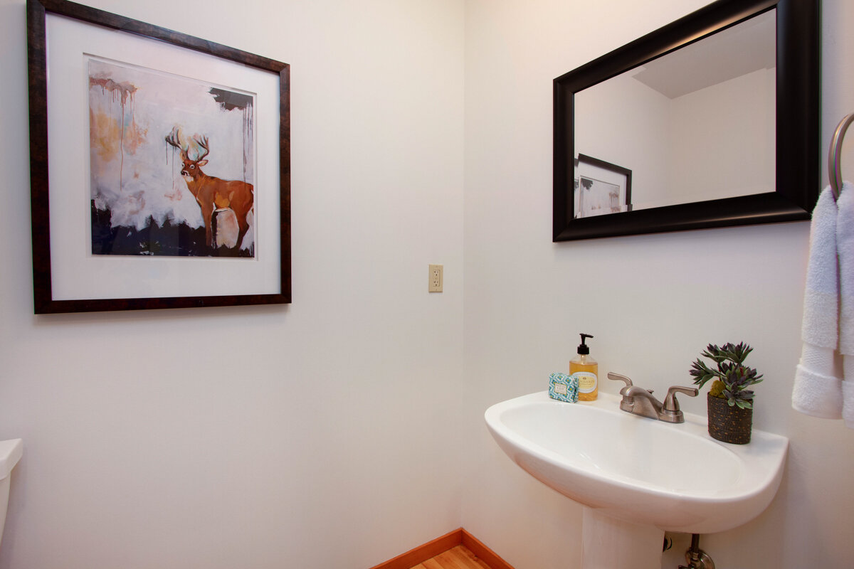 A half bath offers convenient relief for guests. 