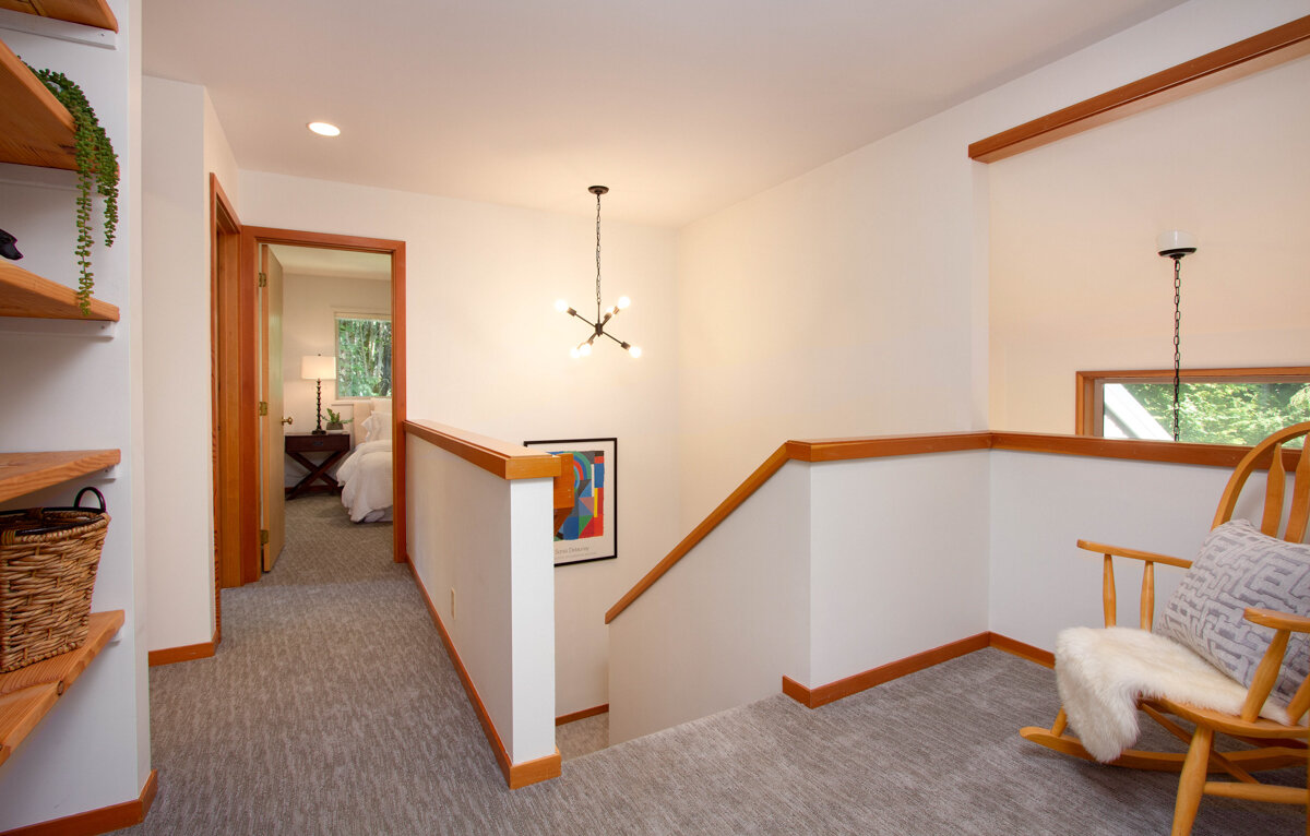 Venture up the stairs to the second floor, where the open landing overlooks the main level. 