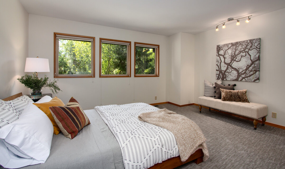 The large master bedroom is a peaceful oasis, filled with generous natural light and accompanied by an en suite bath.  