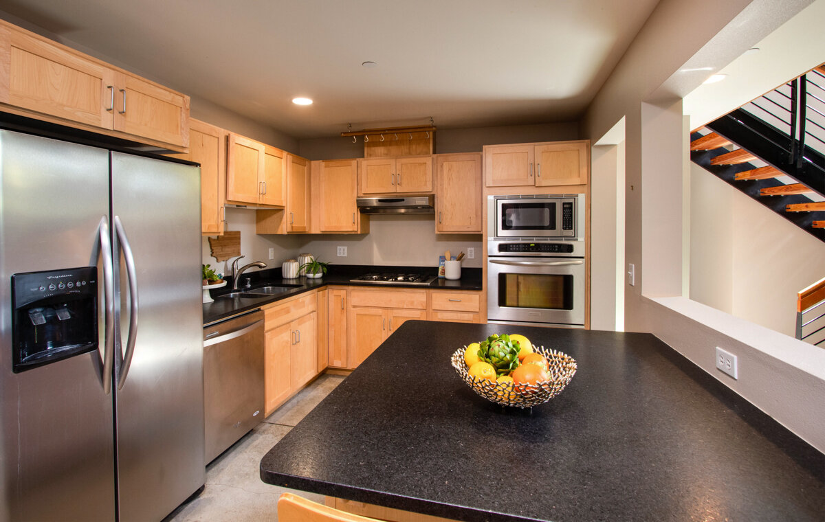 Sleek, stainless steel appliances and plenty of storage make this kitchen both stylish and practical!