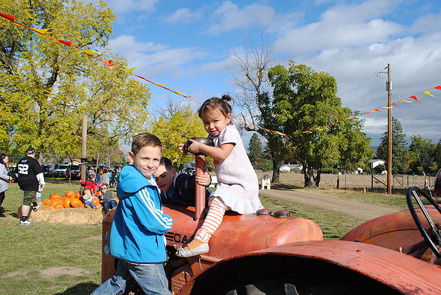 Trevor and Olivia on Tractor at Pheasant Fields Farm.jpg
