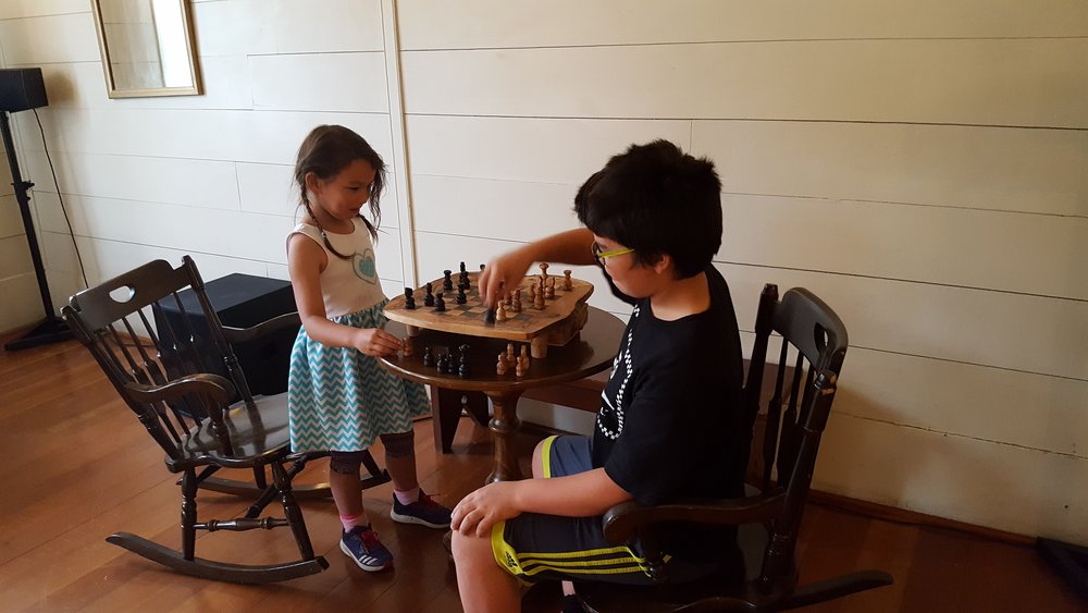 Kids playing Chess in the Ballrooom of Wolf Creek Inn.