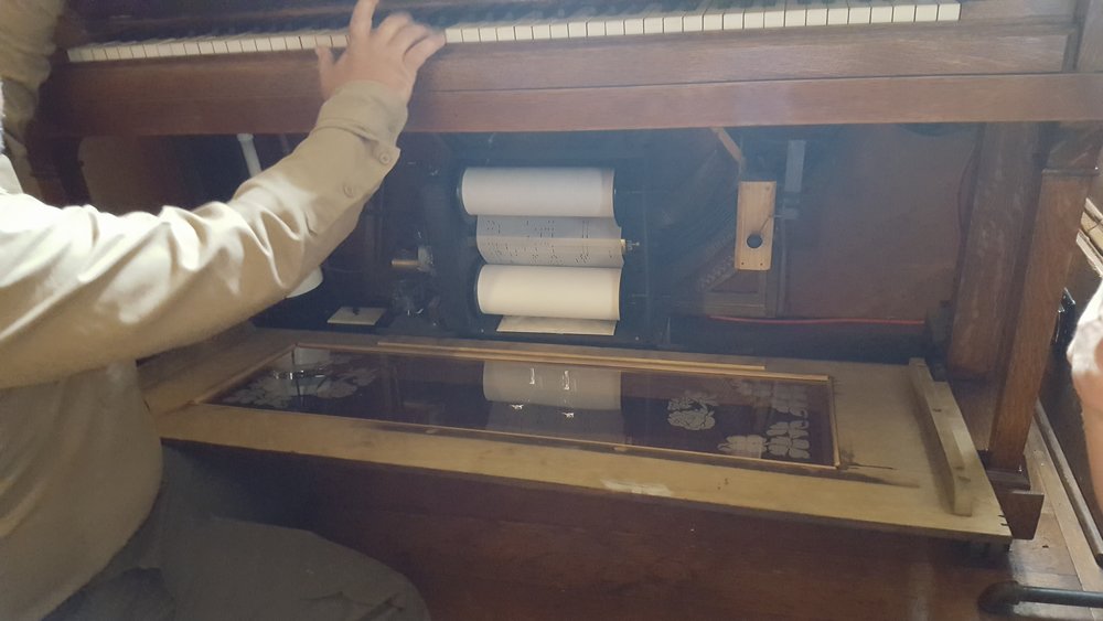 Player piano in the men's tap room at the Wolf Creek Inn