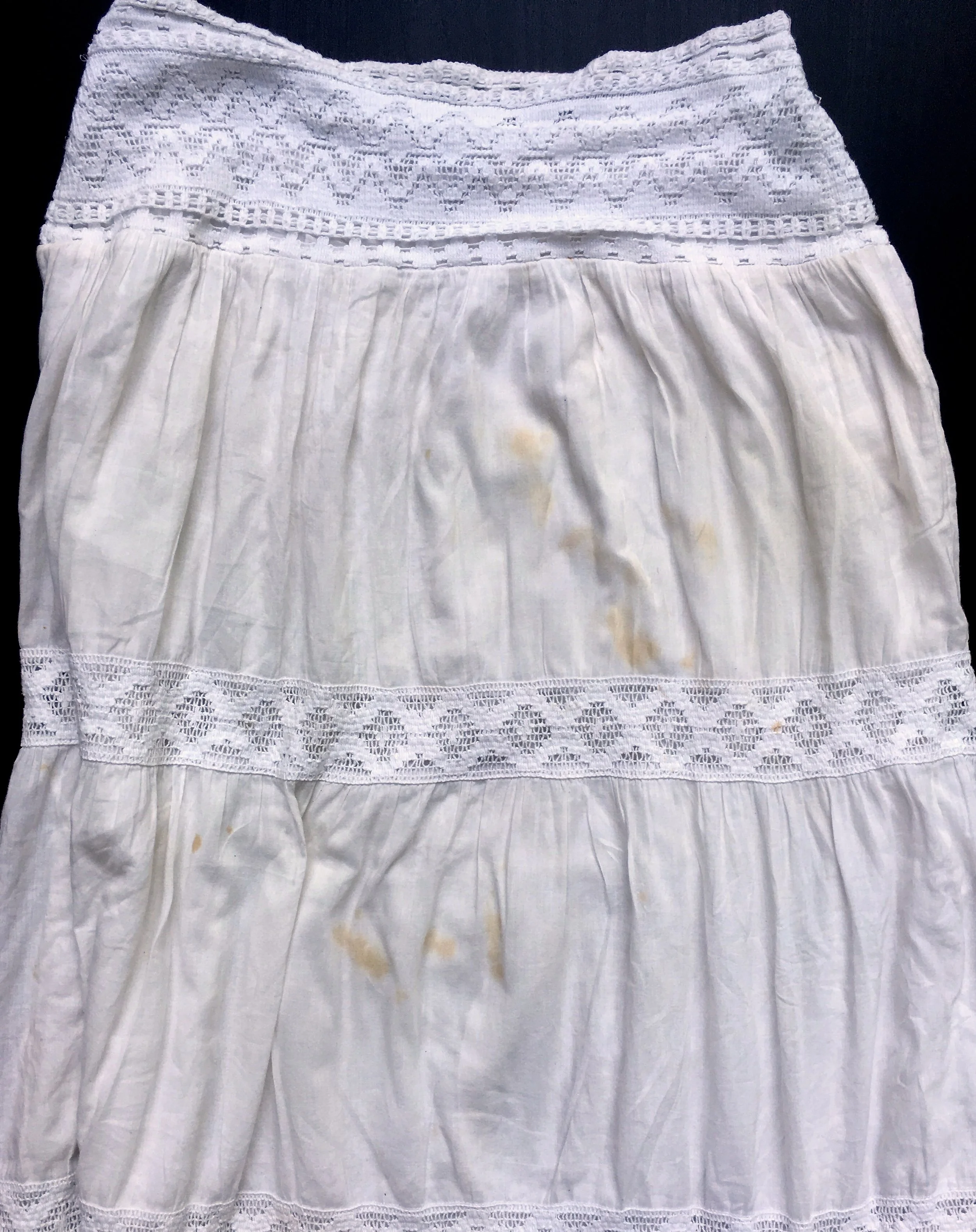 3 laundering attempts + bleach.