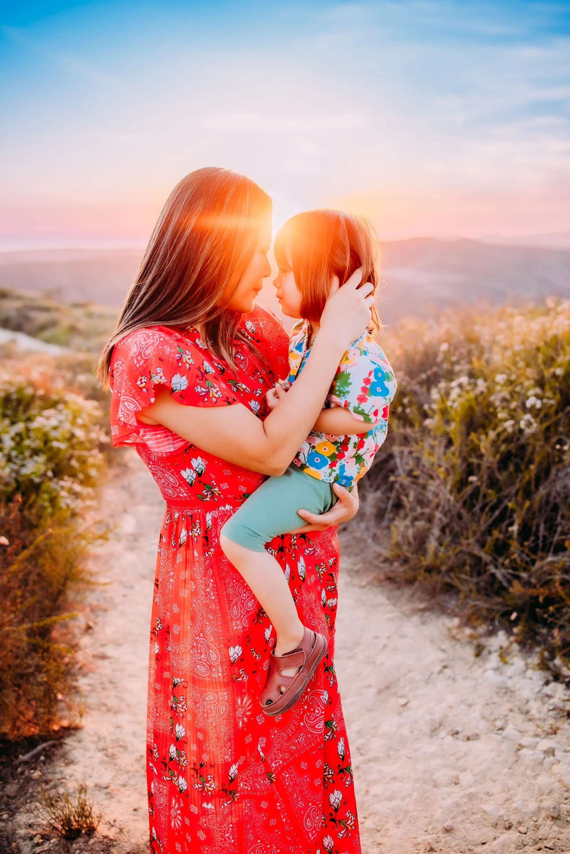 mother and son embracing during their family photo session in the foothills of Laguna Beach, California