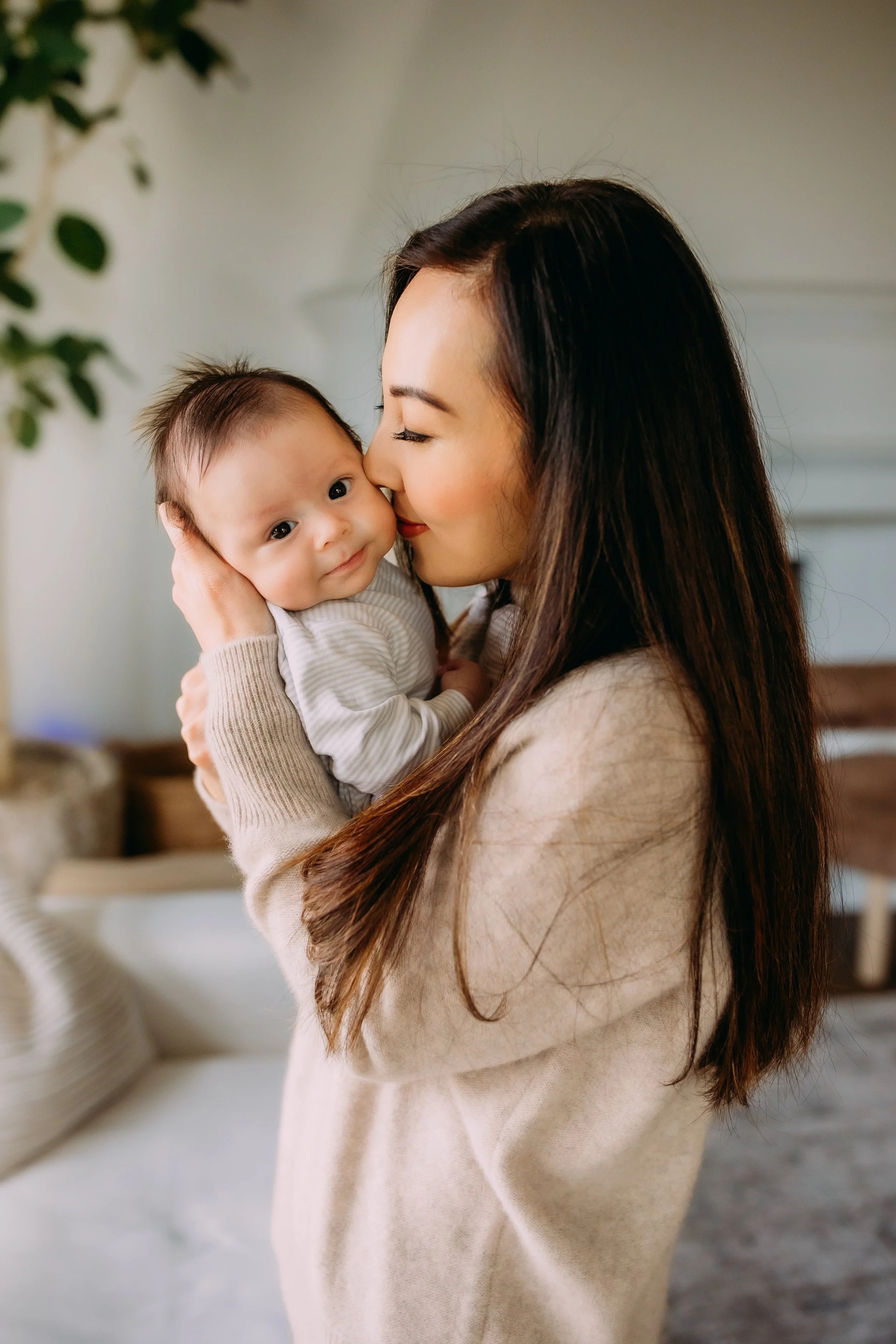 Irvine CA in-home newborn mini session mother holding her newborn baby