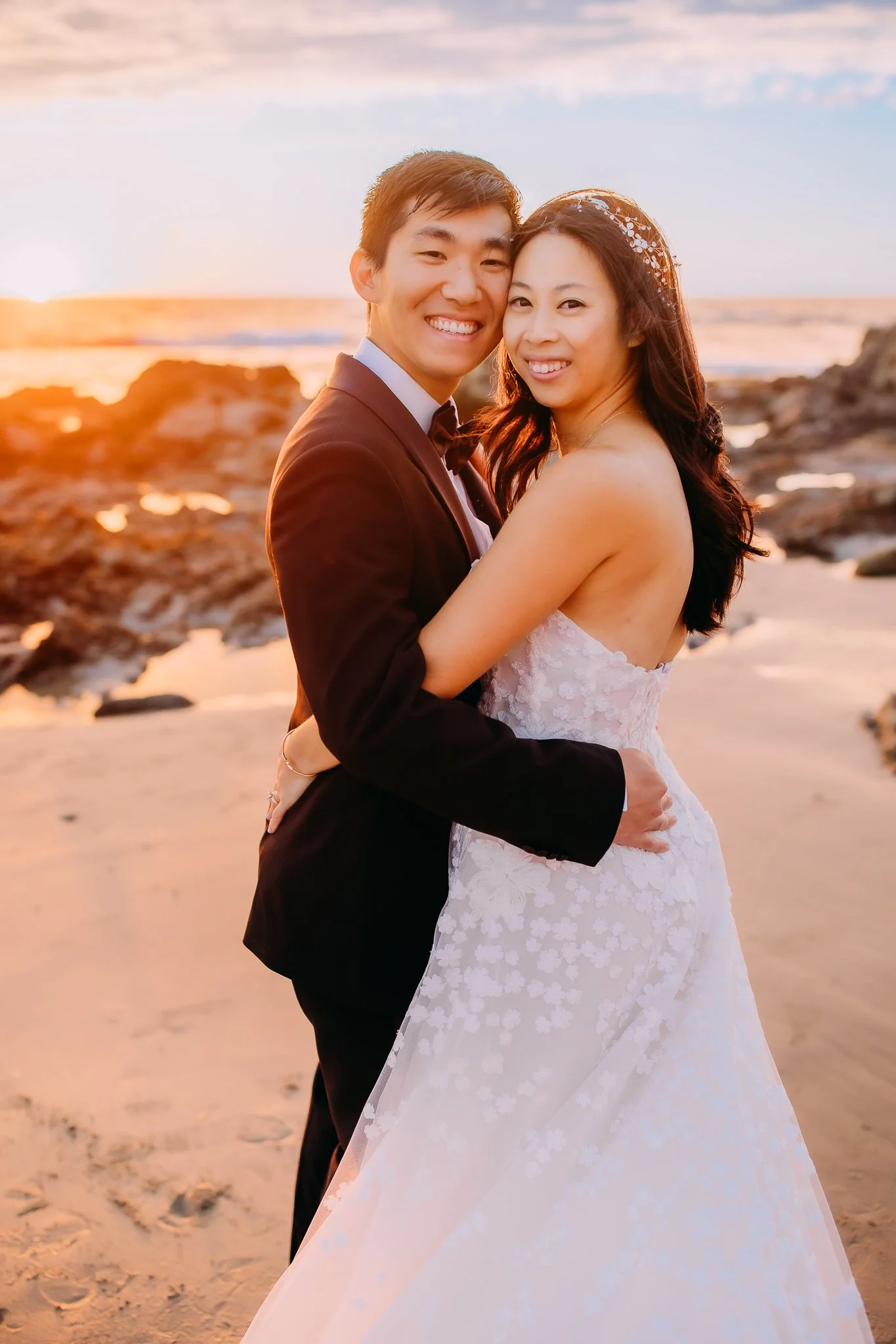 Bride and groom embracing during anniversary portraits in Orange County