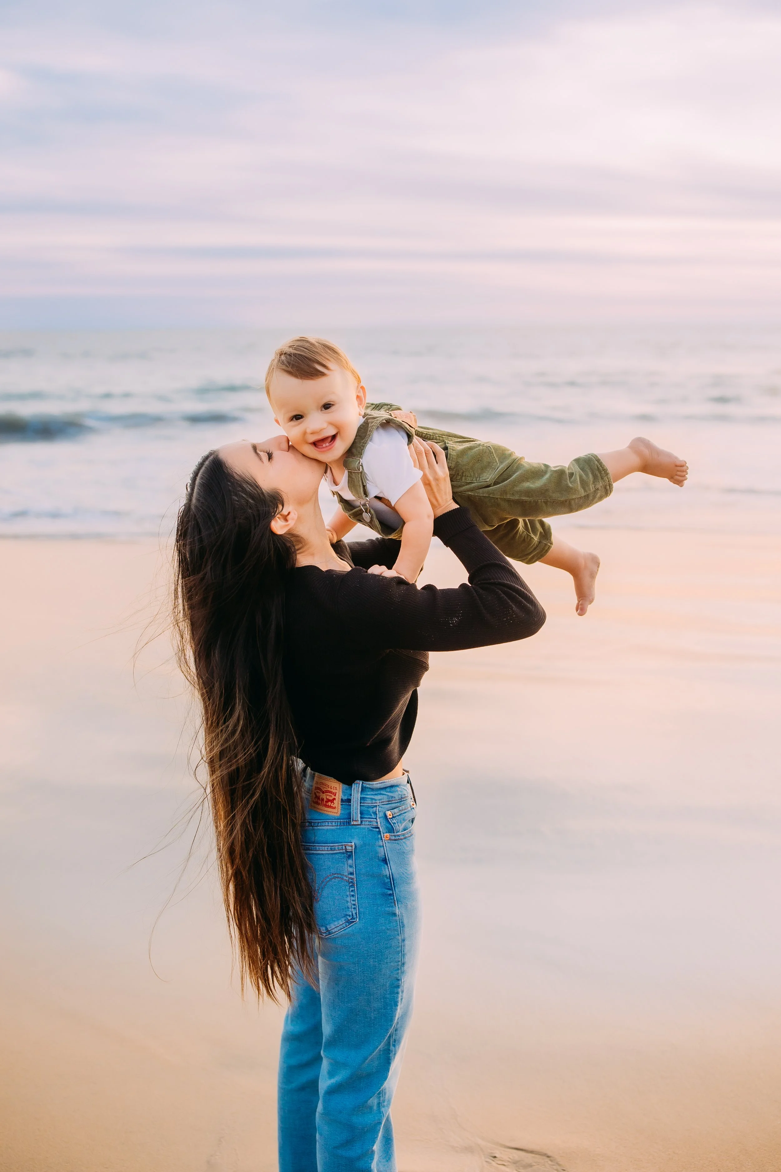 Emotional motherhood portrait of a mom and her one-year-old son in Newport Beach, California.