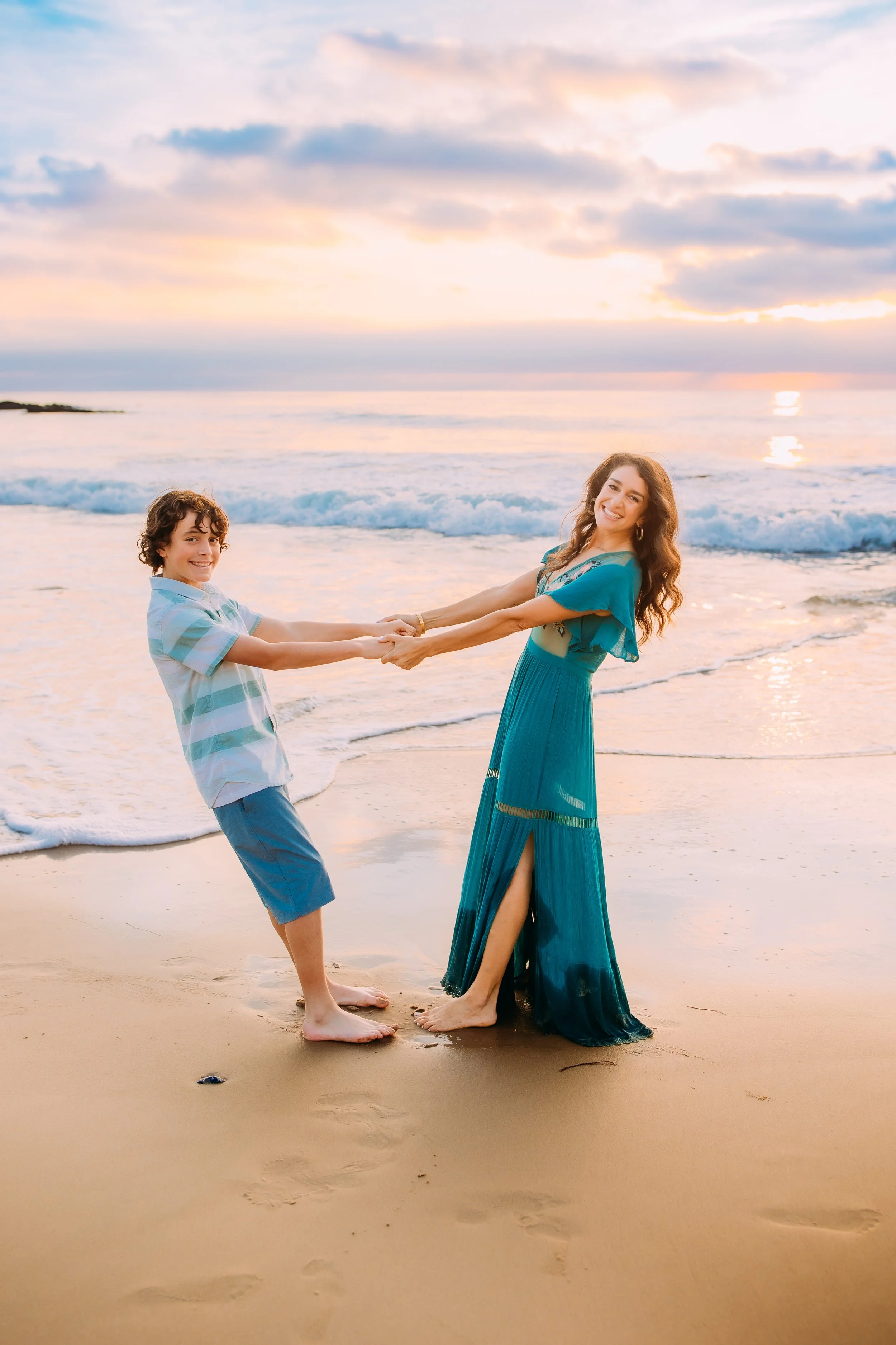 mom and son playfully posing during their photoshoot in Newport Beach, California