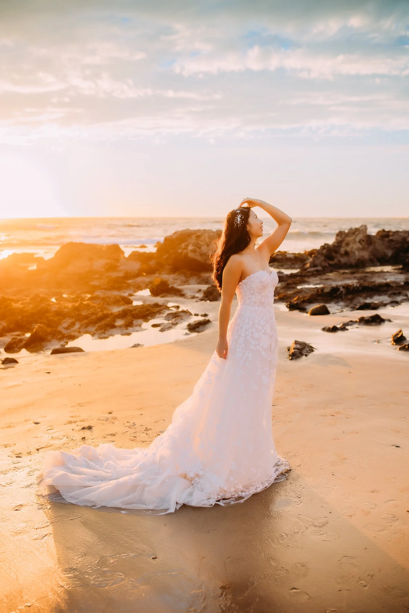 Bride smiling up into the sunset at a Newport Beach sunset session