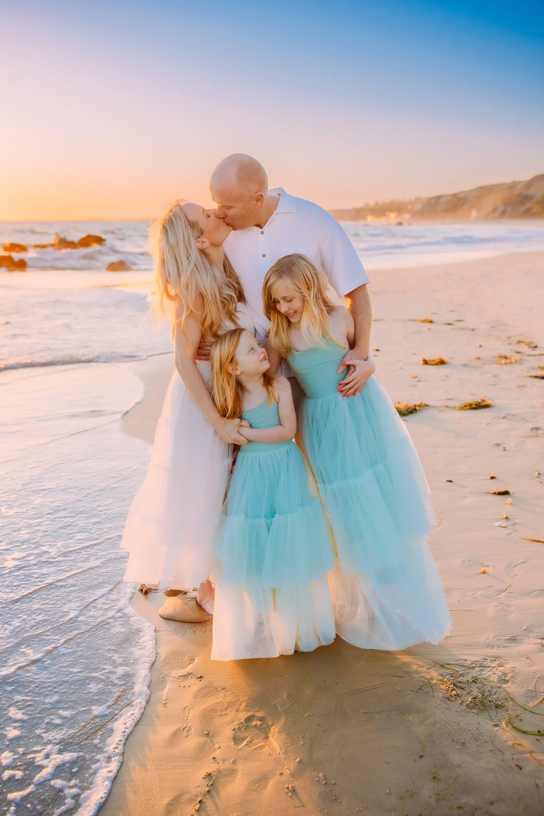 candid and loving family moment during a photoshoot in Newport Beach, California