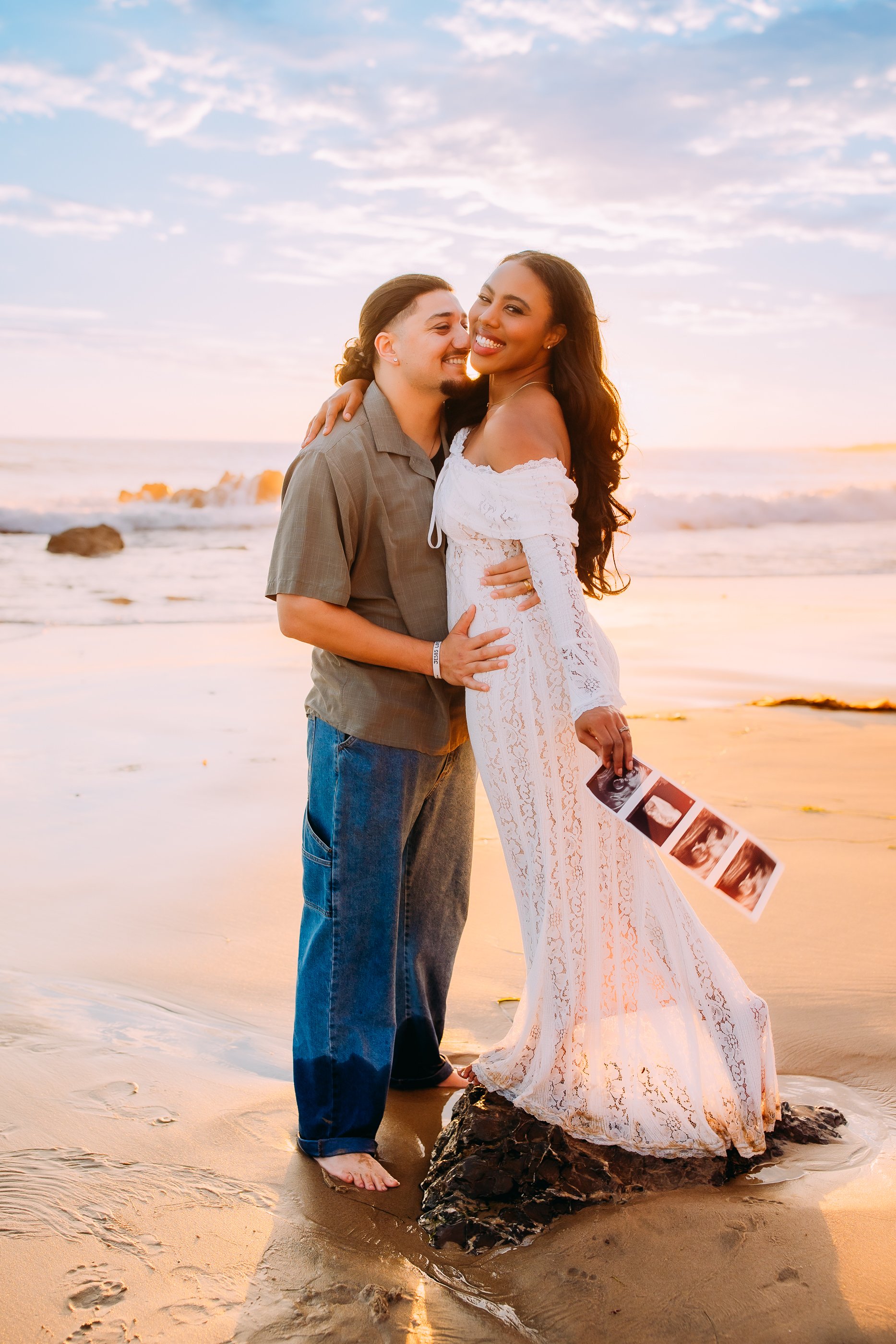 mom and dad to be announcing their pregnancy at their photoshoot in Newport Beach, California