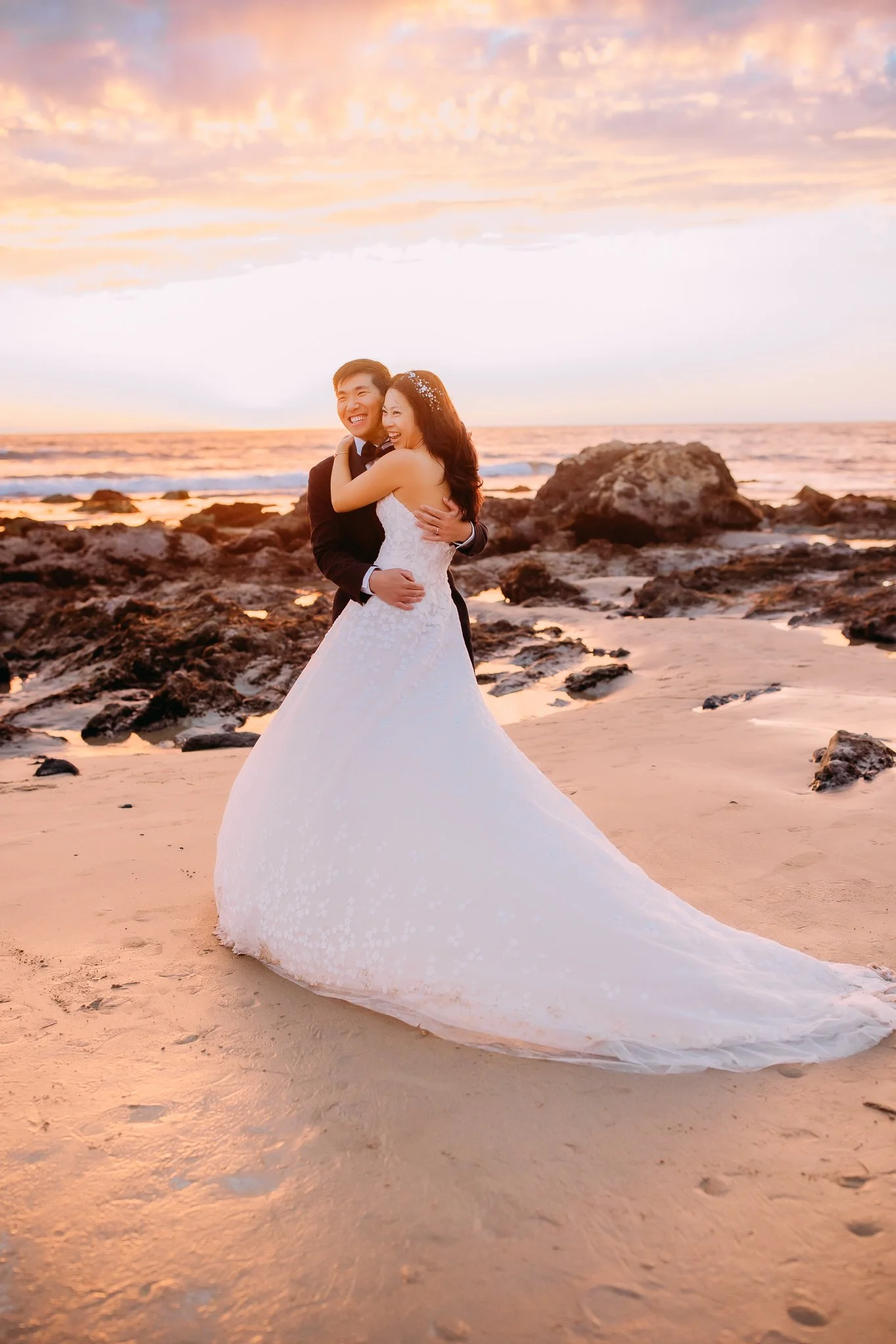 bride and groom happily embracing during their bridal portrait session in Orange County, CA