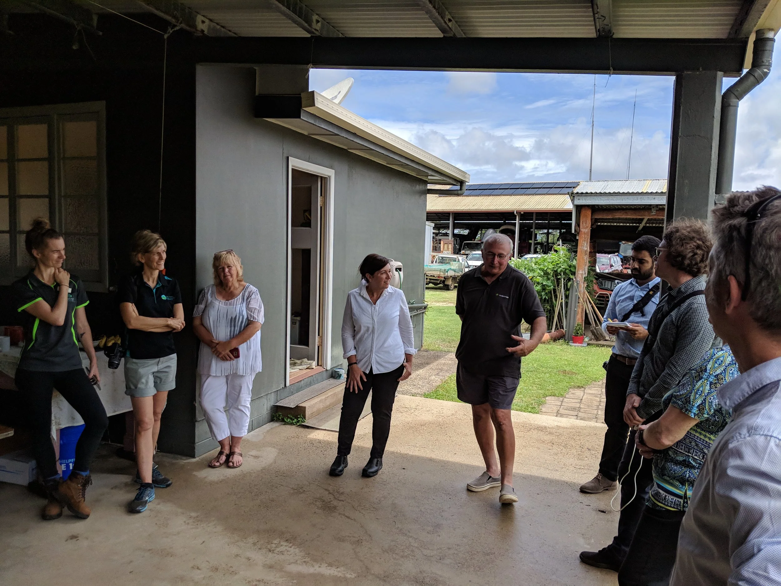 Minister Enoch on farm with Joseph Marano and other representatives of the sugarcane industry.