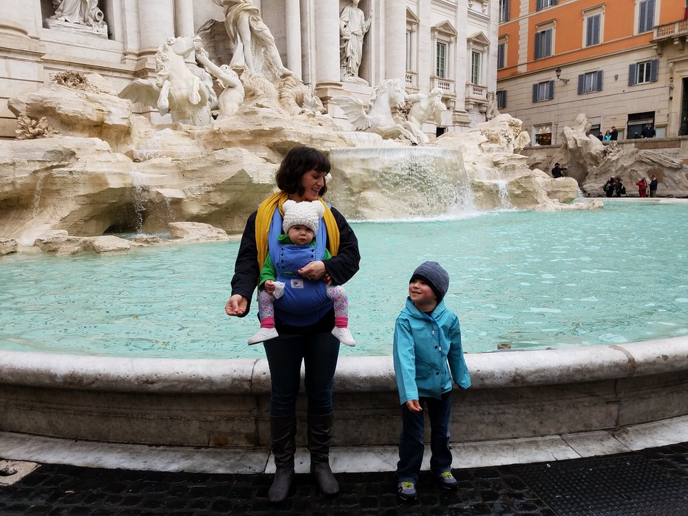 Tossing a coin in the Trevi Fountain
