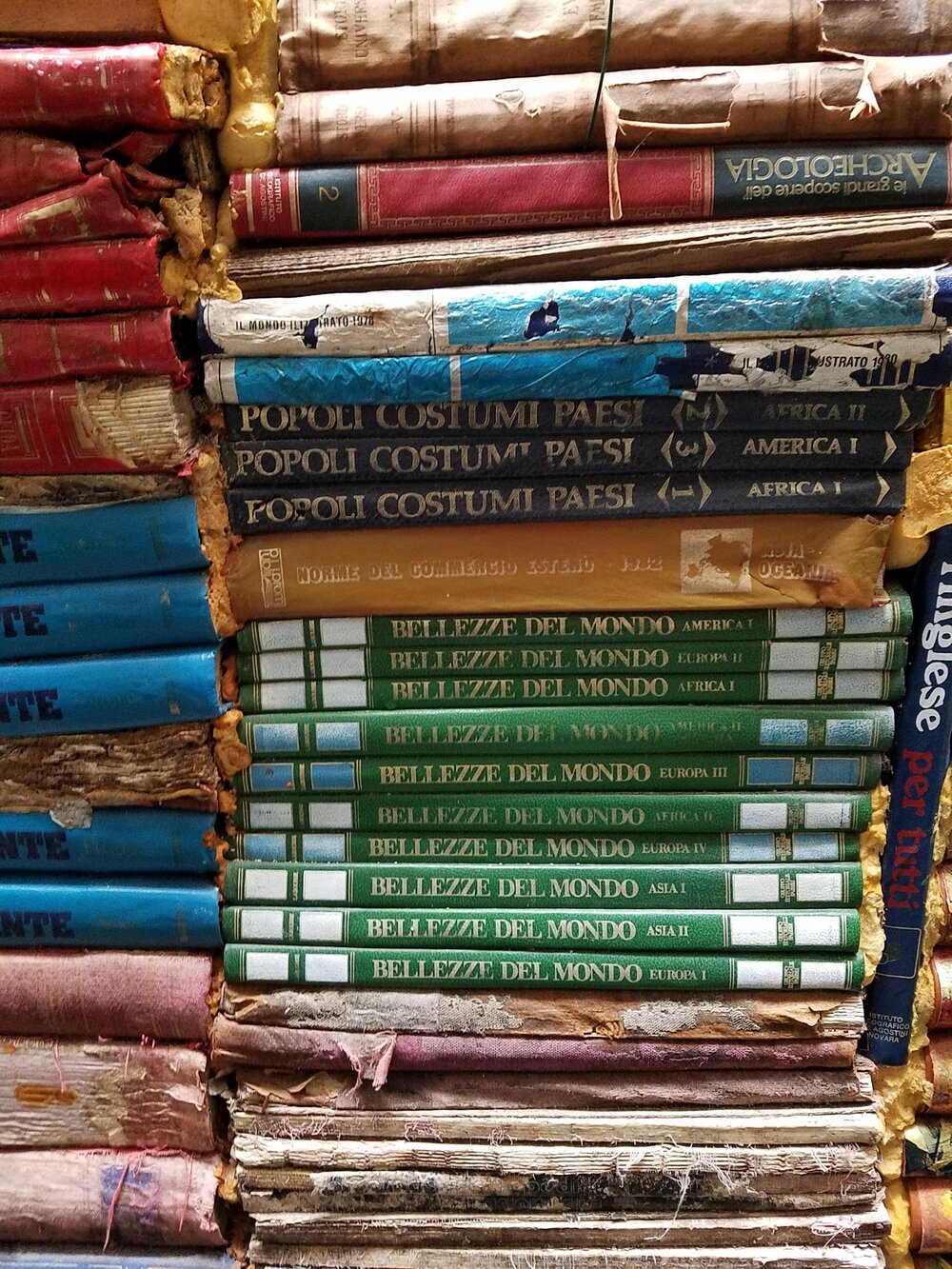 Old book titles lining the walls of the courtyard