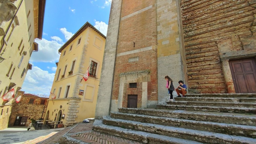 Steps of the Duomo in Piazza Grande - Contucci Cantina in the background