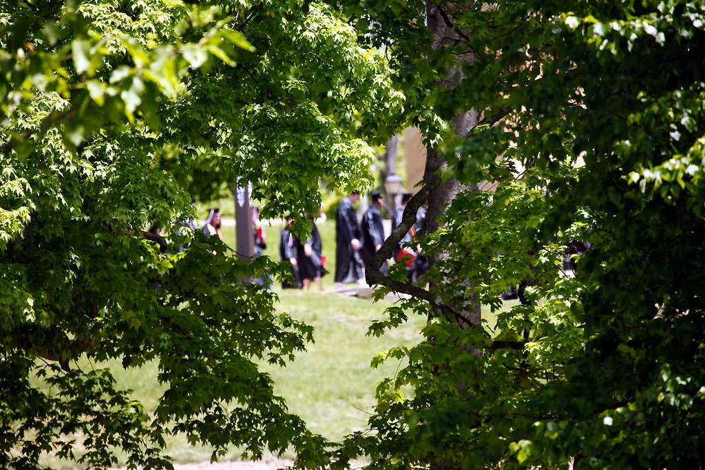 Denison Graduates Through the Trees (Photo by Gone-Walkabout@flickr.com)