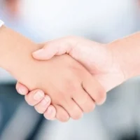 shaking hands women.jpg