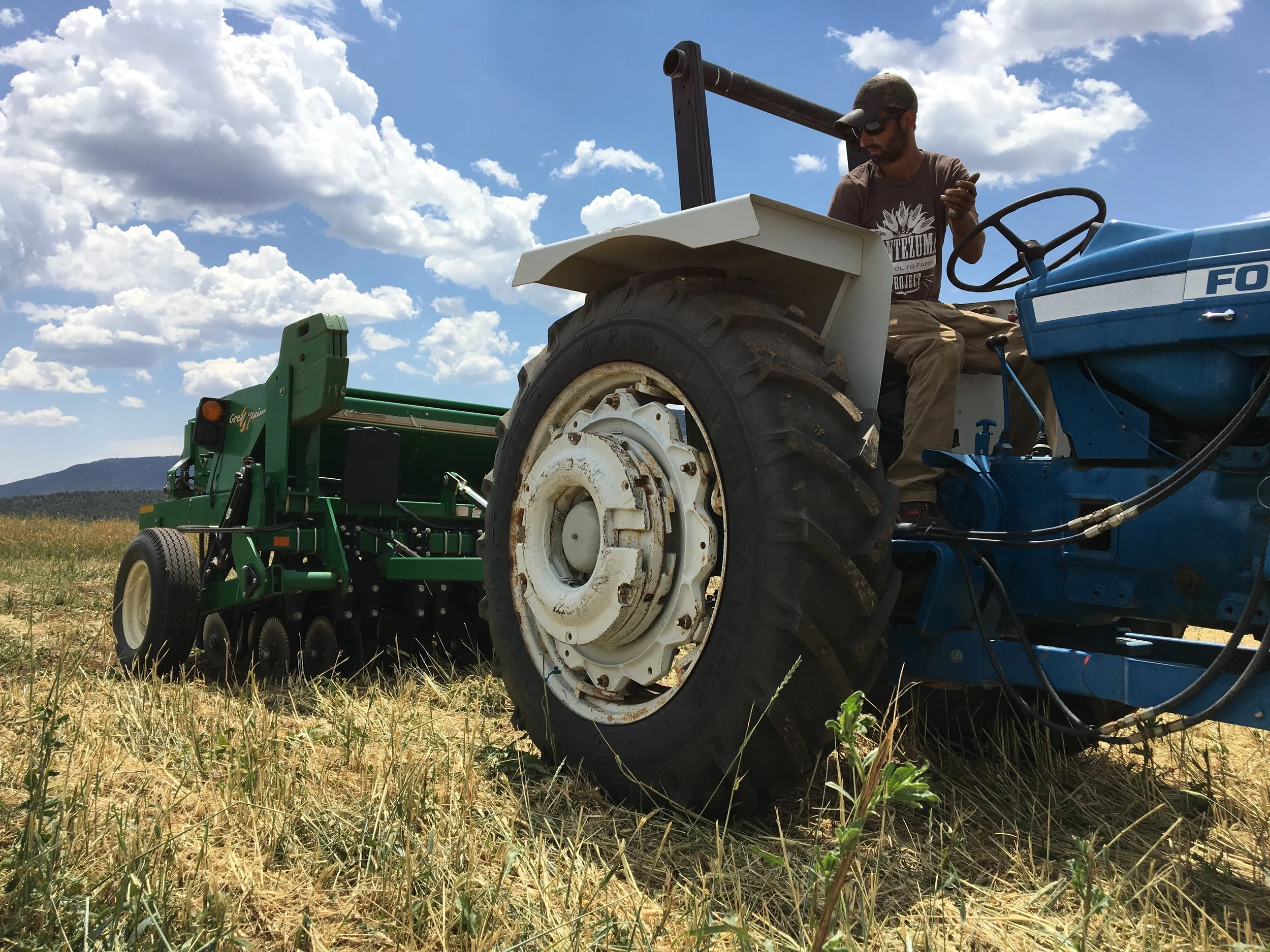 Mike using the No Till Drill from the High Desert Conservation District to seed a cover crop in the section we flail mowed a couple weeks ago.
