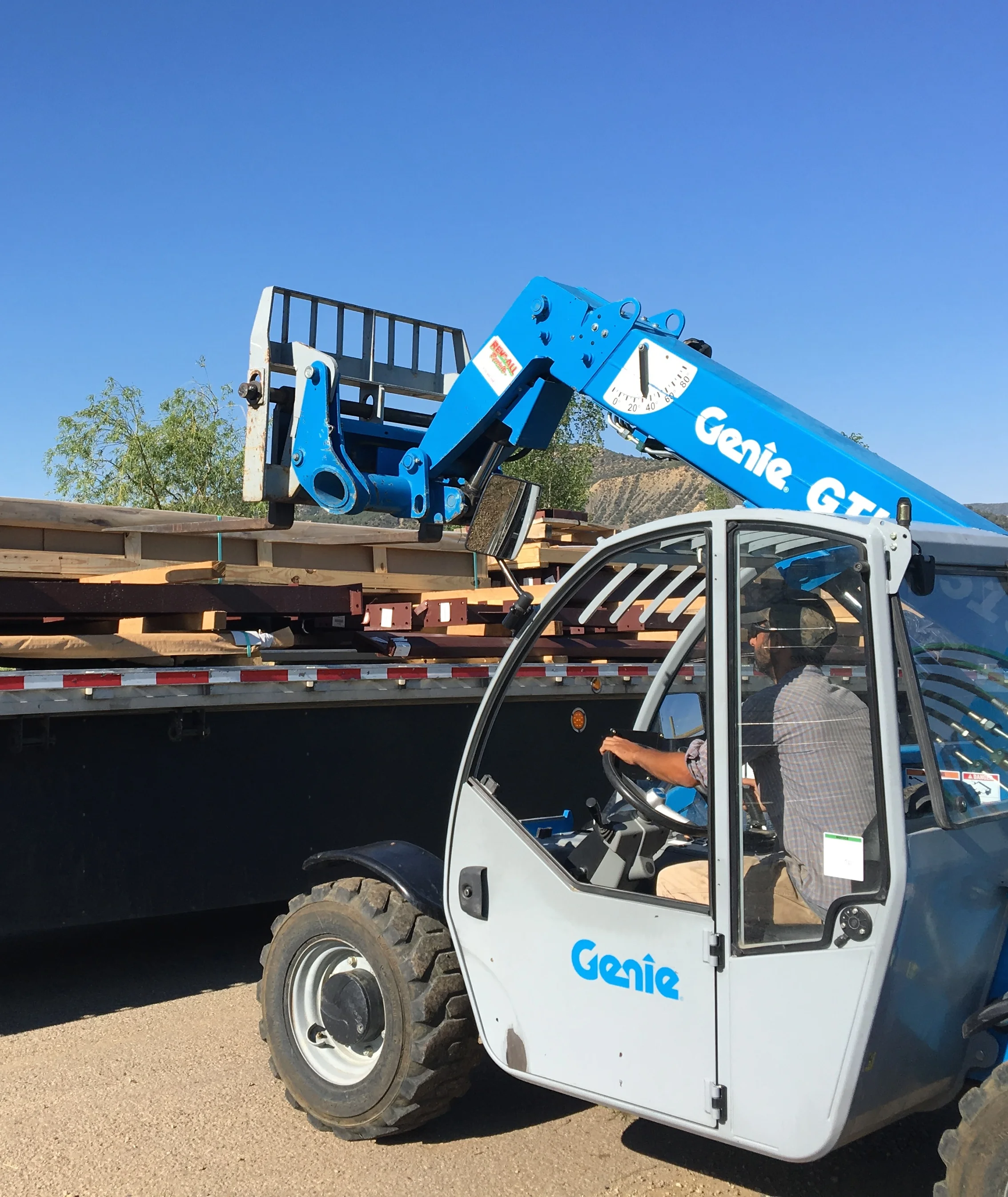 Mike unloading the semi with the materials for our steel building.