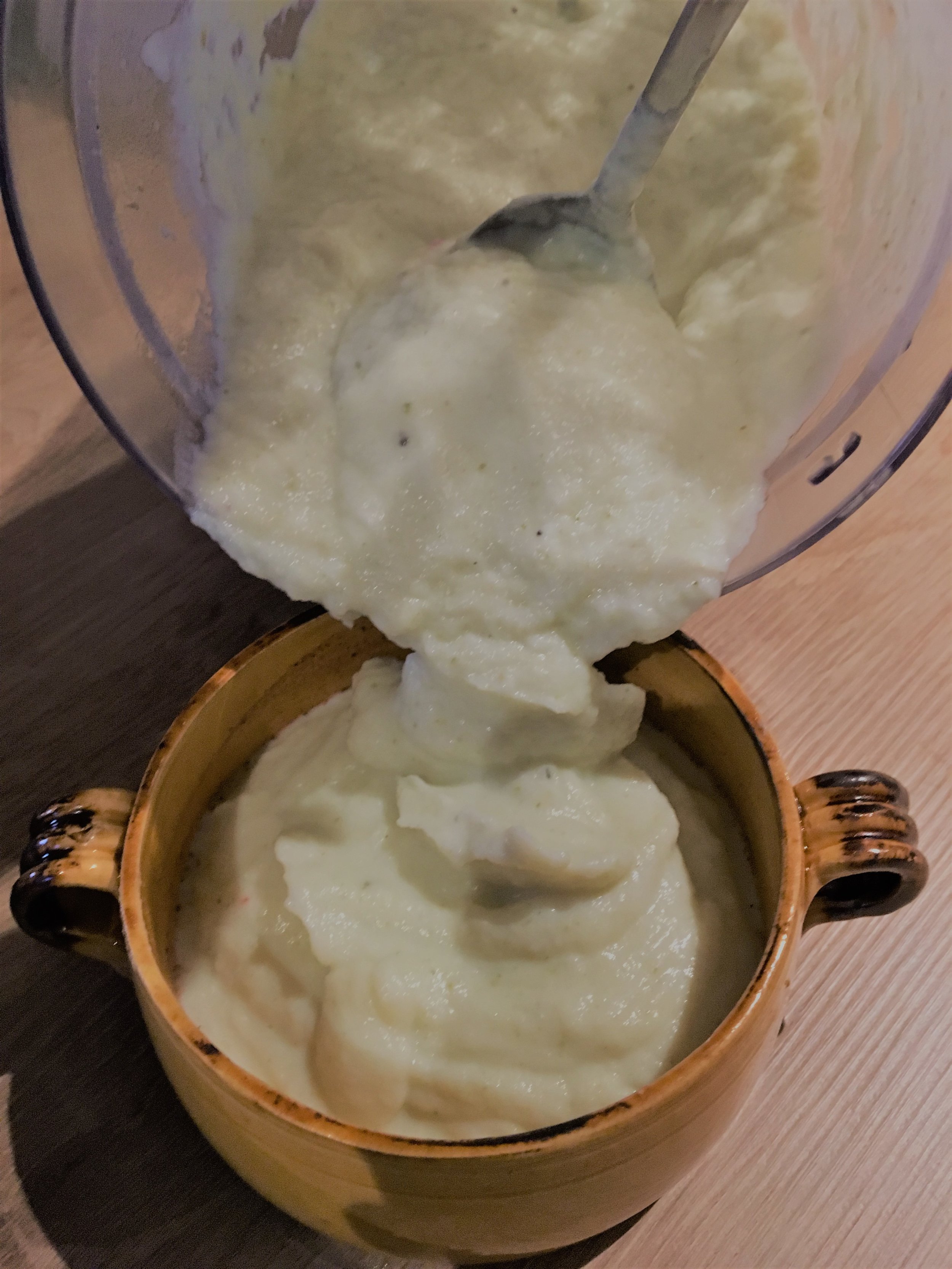  1. Cut the cauliflower and peel the garlic. Steam for 30 minutes.  2. Put all the ingredients in a blender and puree. 