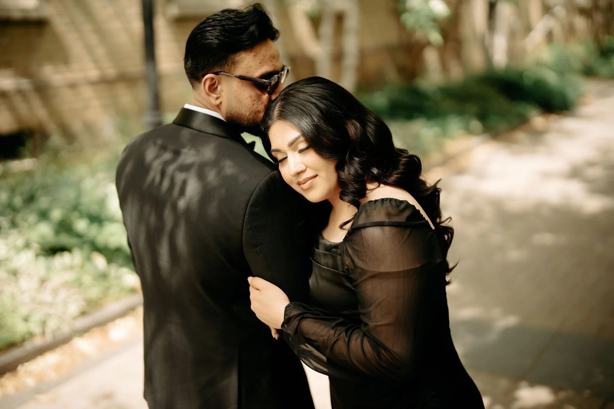 Luxury Muslim wedding photography Toronto – romantic couple portrait near stone pillar.