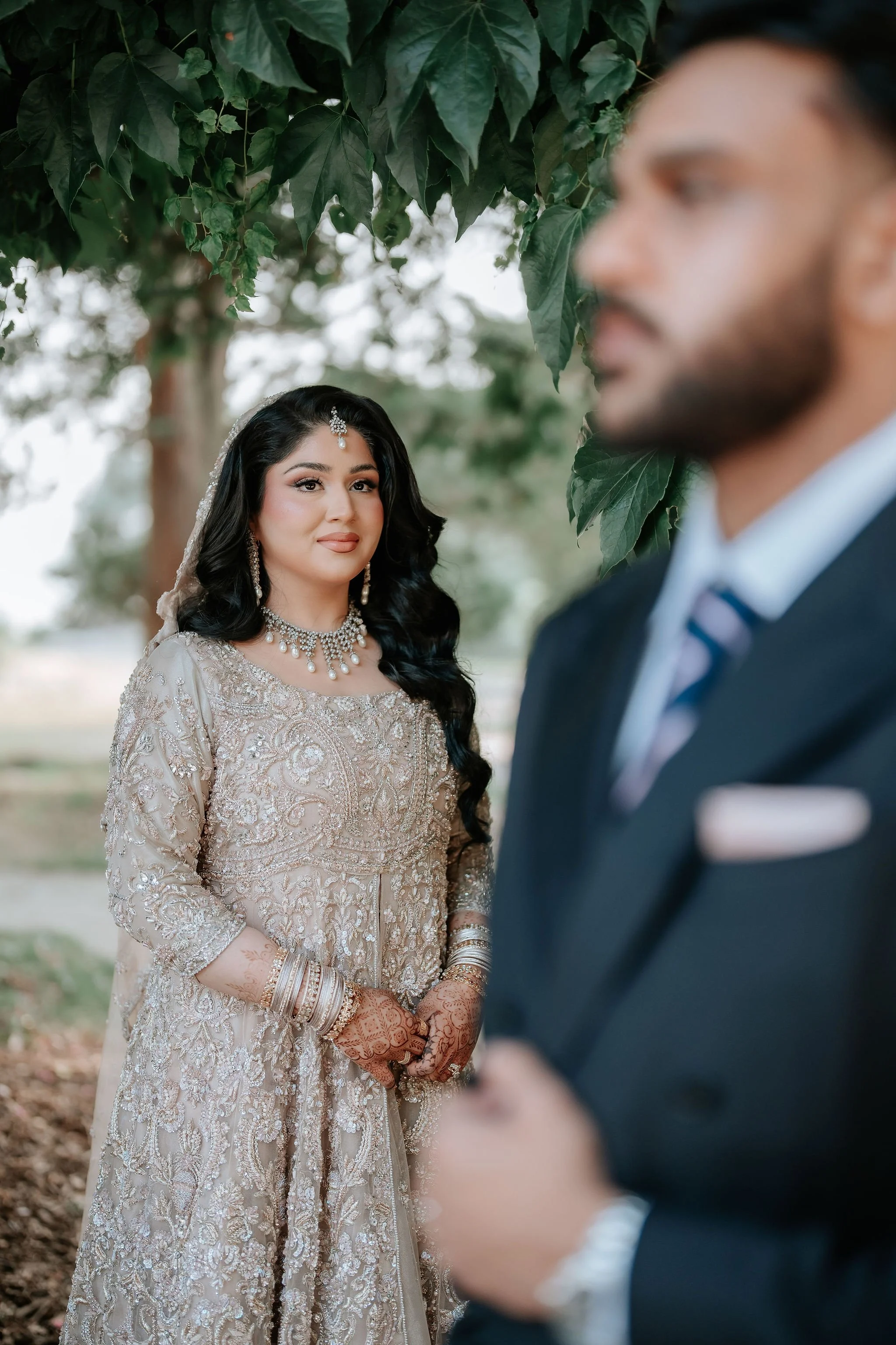Luxury Muslim bridal photography Toronto – bride in champagne gown during outdoor wedding portraits.