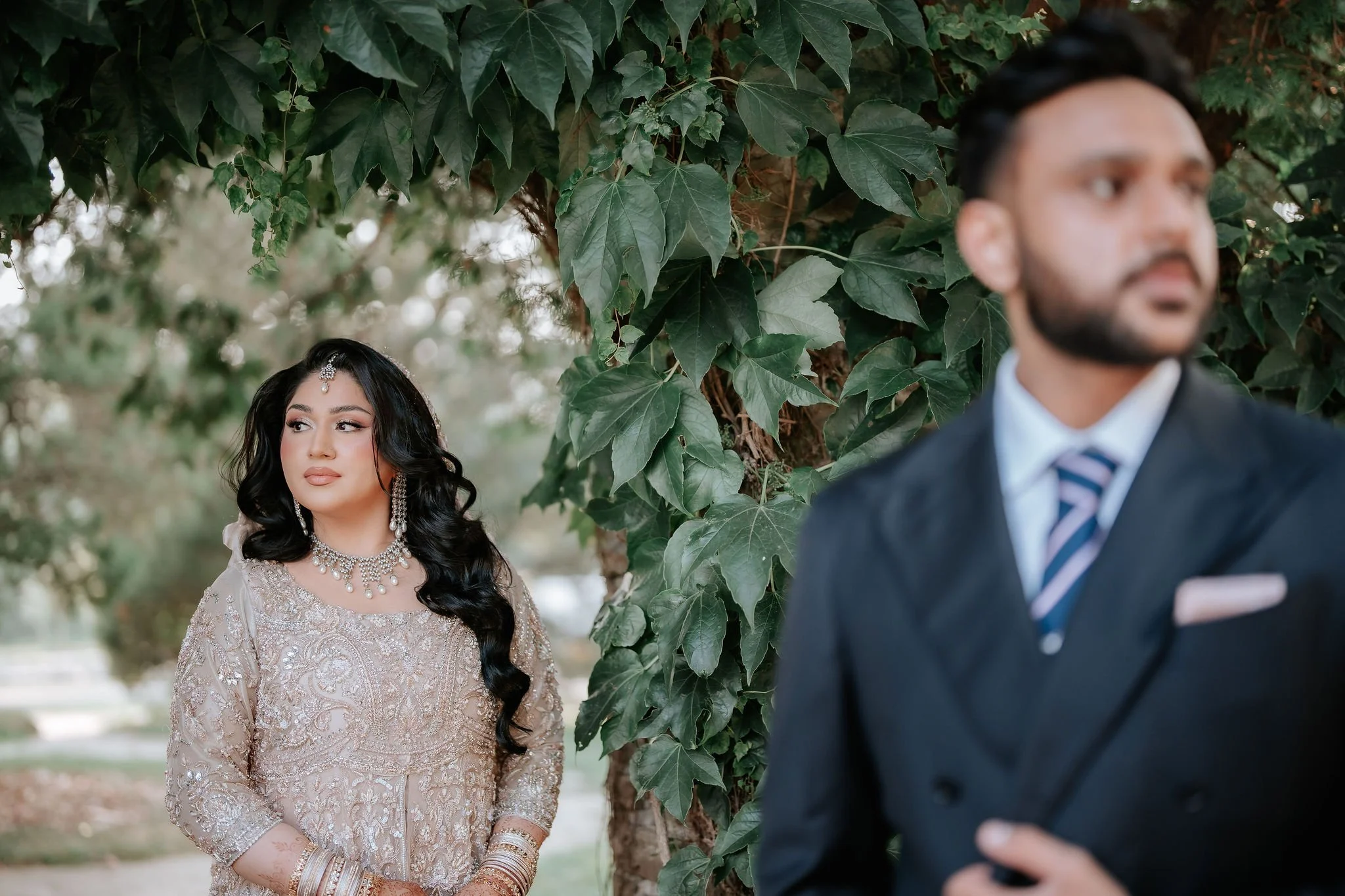 Muslim wedding reception photography Toronto – bride in champagne gown during candid family portraits.