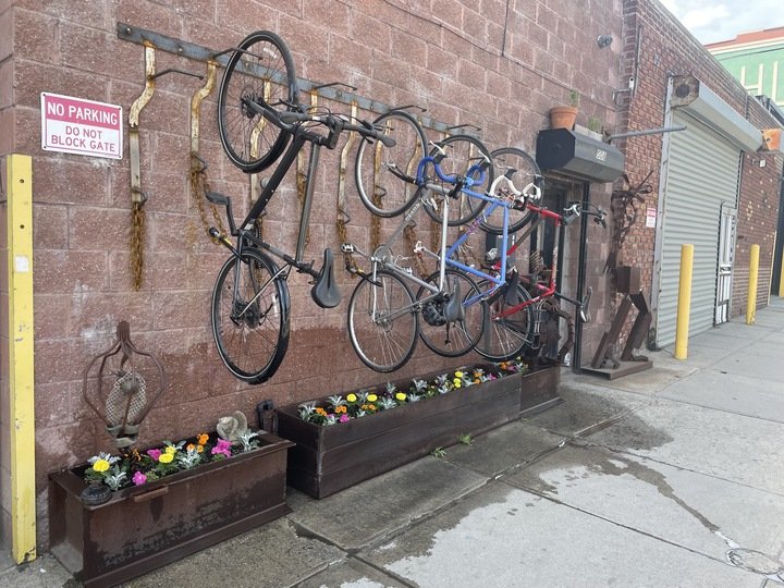 618 Design shop exterior with custom metal bicycle racks and planters.