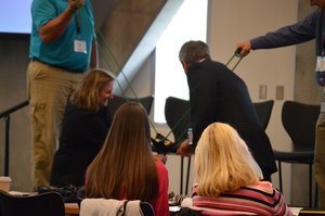  Dr. Ludwig and some audience members conducting a little experiment. 