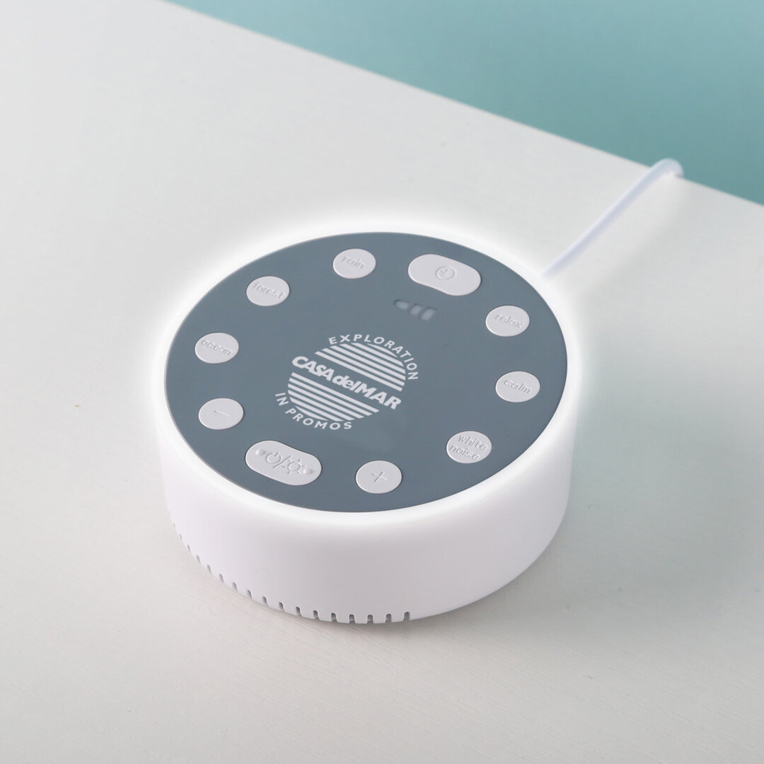 Introducing the Tranquil Zzz Noise Sound Sleep Machine, designed to promote a restful night's sleep. This sleep-enhancing device offers six soothing sounds, LED light with three modes, including a calming breathing light, serving as both a visual rel