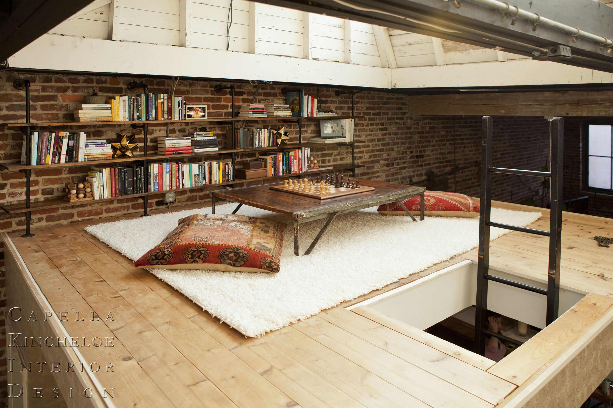 Atlanta Loft Library: brick walls game space reading nook