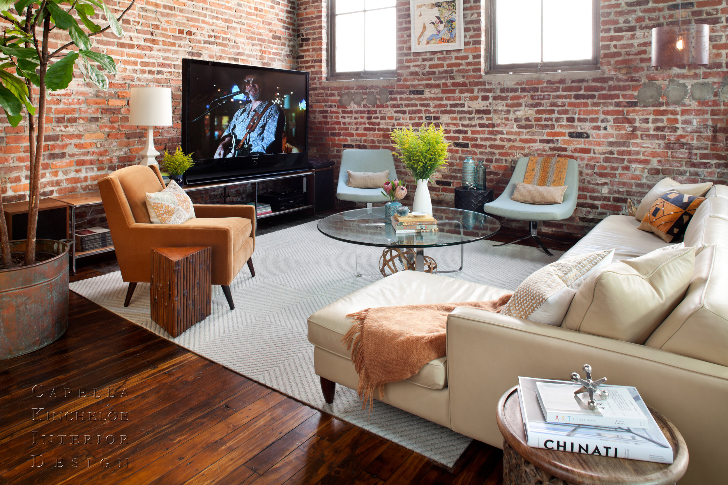 warehouse living in Atlanta, brick walls, American Leather sofa, Room & Board Chairs, fiddle leaf fig tree open concept living 