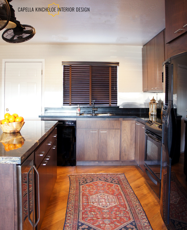 black granite, European walnut cabinets bachelor kitchen, masculine kitchen