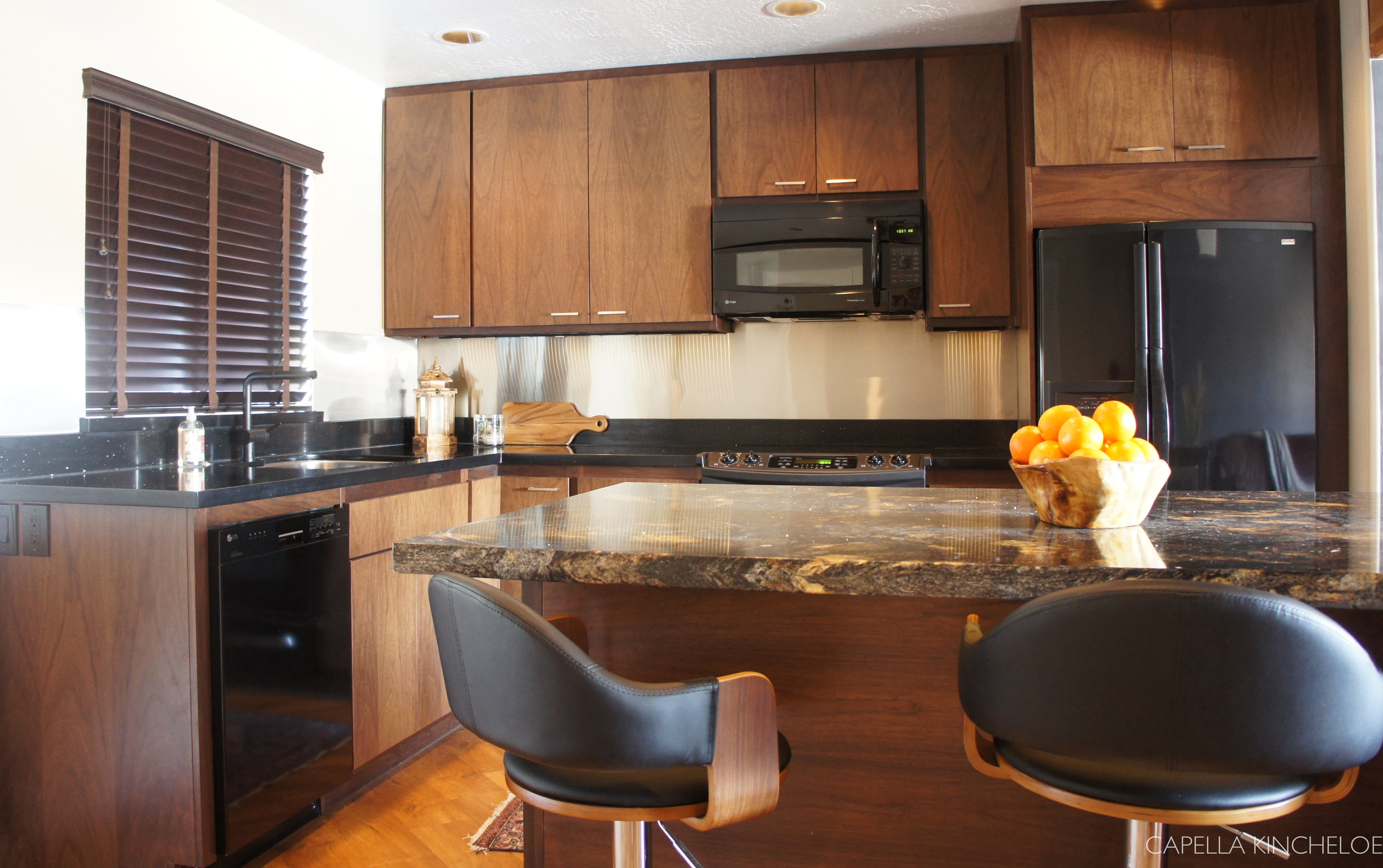 bachelor kitchen, European walnut cabinets, black granite, masculine kitchen, stainless steel backsplash