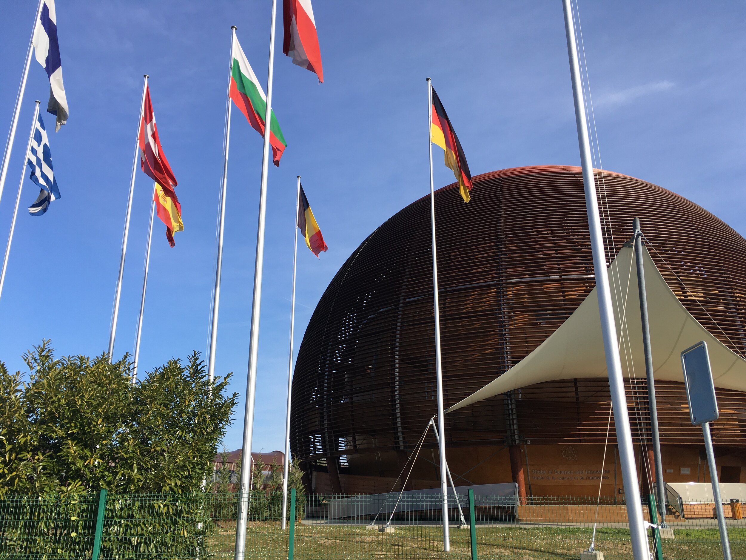 CERN’s Globe of Science and Innovation, with the flags of the member states.