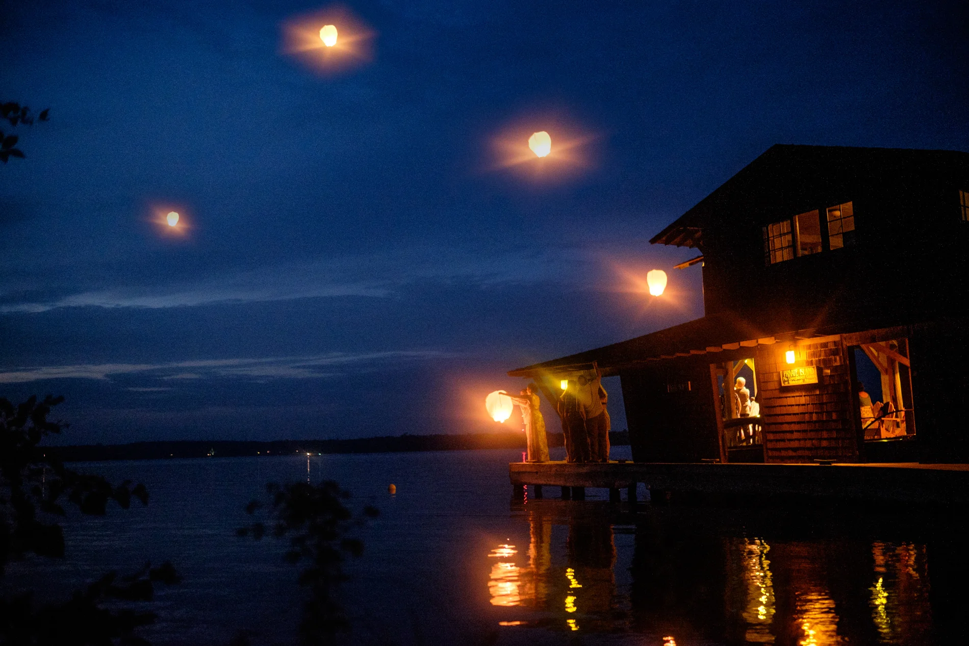Chinese wish lanterns at a boathouse wedding in Northern Wisconsin.