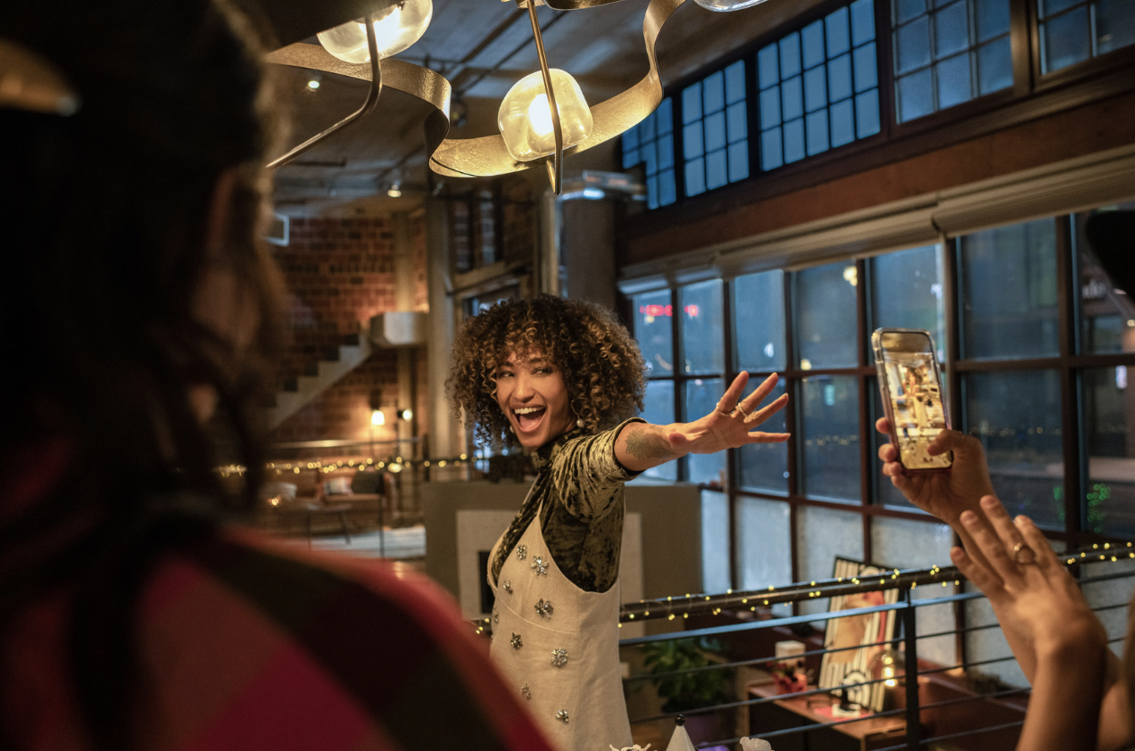 woman evening bar lounge windows warm light cool window.png