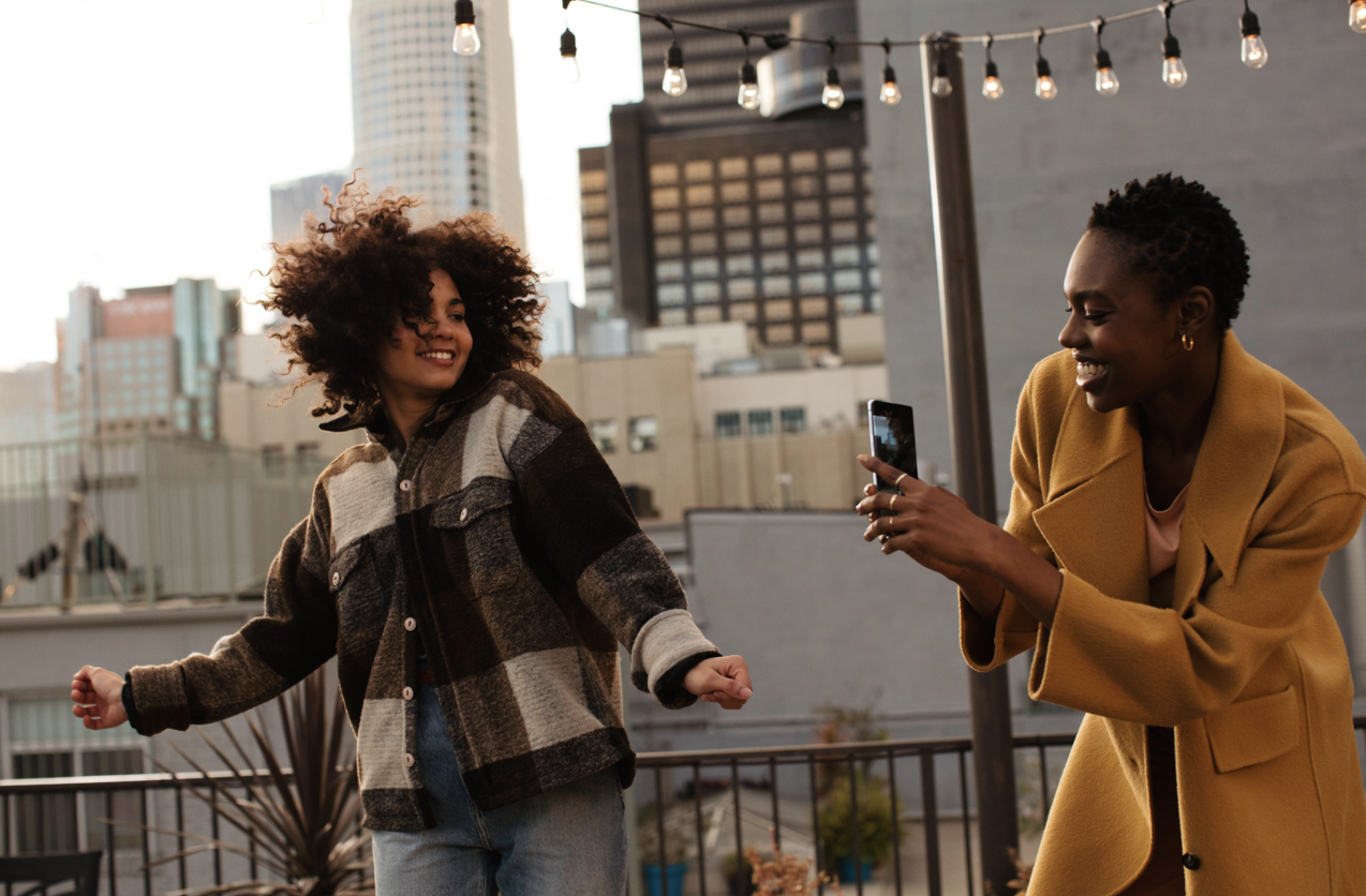 woman selfie rooftop urban city skyline.png